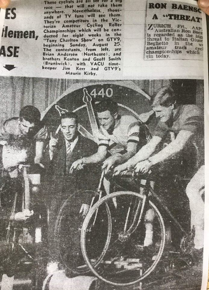 Maurie Kirby compares the Tony Charlton Show (GTV9) with competitors in the Victorian Amateur Cycling Roller Championships. From the left, Brian Anderson (Northcote) and brothers Kenton and Geoff Smith (Brunswick) with Victorian Amateur Cycling Union timekeeper Jim Kerr